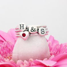 "We love this sweet sentiment of pairing an initial with a birthstone. This stacking initial and birthstone ring set is the perfect gift for the mother or grandmother. Or, wear your own initial and birthstone! **This listing comes in sets of two - each set having an initial ring and a birthstone rings. You can order multiple sets. ** Need a different combo of rings in your set? Create your own set here: https://www.etsy.com/listing/230740149 These rings are also available in 24K gold at this lis Personalized Couples Rings As Gifts, Personalized Initial Ring For Valentine's Day Anniversary, Personalized Initial Ring For Anniversary On Valentine's Day, Personalized Couple Rings For Valentine's Promise, Personalized White Stackable Rings For Anniversary, Personalized Couple Rings As Gift, Personalized Pink Ring For Birthday, Personalized Couple Rings For Gift, Personalized Couple Rings For Gifts