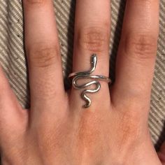 Brand New Silver Snake Ring. This Ring Is Really Cool And I Love How The Snake Looks! It Is One Size Fits All As Well. Also Comes In A Box! Minimalist Silver Snake Ring As Gift, Adjustable Metal Snake Ring As Gift, Symbolic Midi Rings As Gifts, Metal Snake Ring With Open Design For Gift, Metal Open Snake Ring For Gift, Snake Shape Metal Ring As Gift, Symbolic Adjustable Snake Ring Gift, Adjustable Symbolic Snake Ring Gift, Silver Snake Ring