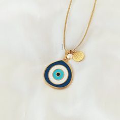 *Necklace with pendant evil eye (blue & turquoise colors) *Pearl stone & gold charm *Gold waxed cord *No clasp - Adjustable length **If you need more information feel free to contact me! For more jewelry take a look! www.etsy.com/shop/christelboutique Thank you! Facebook: my christel Instagram: @mychristel_ Bohemian Gold Charm Necklaces With Evil Eye, Evil Eye Charm Necklace With Round Pendant As Gift, Bohemian Gold Charm Necklace With Evil Eye, Evil Eye Charm Necklace With Round Pendant For Gifts, Evil Eye Amulet Pendant Charm Necklace, Amulet Style Evil Eye Pendant Charm Necklace, Adjustable Evil Eye Amulet Necklace, Evil Eye Amulet Charm Necklace, Evil Eye Charm Necklace With Round Pendant