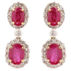 Ruby and Diamond Dangle Wedding Earrings in 18K Gold to make a statement with your look. These earrings create a sparkling, luxurious look featuring oval cut gemstone. If you love to gravitate towards unique styles, this piece of jewelry is perfect for you. PRODUCT DETAILS :- Material - 18K Solid Yellow Gold Gemstone - Ruby Gemstone Weight - 2.89 ct Gemstone Shape - Oval Gemstone Pcs - 4 Gemstone Size - 5 x 7 mm Diamond Weight - 0.71 ct Diamond Size - 1.2 mm Gross Weight - 5.624 Grams Setting - Red Ruby Diamond Earrings For Wedding, Luxury Ruby Diamond Earrings For Wedding, Red Ruby Diamond Earrings Gift, Luxury Oval Ruby Earrings, Luxury Ruby Gemstone Earrings, Gold Earrings Wedding, Mother Daughter Gifts, Ruby Gemstone, Diamond Drop Earrings