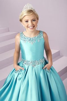 Expertly designed for the modern princess, the Tiffany Princess 13485 Girls Pageant Dress is a stunning Mikado A Line masterpiece. Embellished with intricate beadwork and featuring convenient pockets, this open back ball gown will make any young lady feel like royalty. A beaded scoop neckline and waistband showcase this adorable gown. Complete with a box pleated, a-line mikado skirt with front Pockets, and an open back with lace-up. Sizes: 4 Colors: Lipstick (Pink) Embellished Sleeveless Princess Dress For Pageant, Princess Style Sleeveless Embellished Pageant Dress, Sleeveless Embellished Princess Dress For Pageant, Elegant Embellished Sleeveless Princess Dress, Elegant Sleeveless Embellished Princess Dress, Embellished Princess Style Pageant Dress, Embellished Sleeveless Dress For Pageant, Princess Style Embellished Pageant Dress, Embellished Princess Dress For Pageant