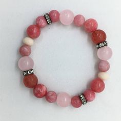 "💘 Rose Quartz, Pink Jade & Cherry Agate Gemstone Bracelet, Valentines Day Gift for Her, Boho Healing Bracelet. Colorful semi precious bracelet. Free Shipping.  Accents are Gunmetal Crystal Spacer beads, they sparkle like CRAZY! So easy to LOVE! Our Bracelets look amazing stacked and layered, wearing more than one is so much FUN! 8mm, 10mm and 12mm Polished Semi Precious Polished Rose Quartz, Pink Jade and Cherry Agate Gemstone Beads. This listing is for one (1) Bracelet and comes packaged in C Pink Jade Jewelry As A Gift, Pink Jade Jewelry Gift, Pink Jade Jewelry For Gift, Adjustable Gemstone Beads Jewelry For Valentine's Day, Pink Rose Quartz Stretch Bracelet With Natural Stones, Pink Rose Quartz Natural Stone Stretch Bracelet, Adjustable Pink Opal Bracelet, Adjustable Rose Quartz Stretch Bracelet Gift, Pink Adjustable Stretch Bracelet With Natural Stones