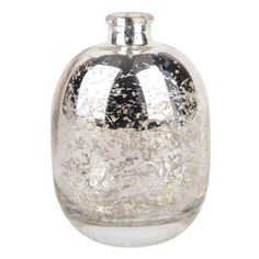 a glass bottle with silver flecks on the top and bottom, sitting in front of a white background