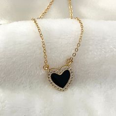 Elegant heart necklace. Upgrade your jewelry collection with this stunning Black Heart Necklace.  This dainty heart necklace is a lovely gift for your loved one, perfect as an anniversary gift. Order yours today and enjoy its timeless beauty! ♥ ITEM DESCRIPTION: The total length of the gold necklace: is 14, 16, 18, 20  inches. The length of the necklace refers to the total length from end to end. Pendant height: 1.7 cm Pendant width: 1.6 cm Materials: 18k Gold plated - Enamel with zirconia heart Black Heart Necklace, Dainty Heart Necklace, Tiny Heart Necklace, Valentines Necklace, Tiny Heart, Necklace Black, Necklace Dainty, Black Heart, Organza Bags