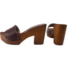 HANDMADE CLOGS wood-effect clogs made in italy -brown leather upper -heel 9 cm + plateau 3 cm -craftsman-made DON'T FORGET TO CHECK THE SIZE BEFORE YOU COMPLETE THE ORDER Size and LENGTH OF THE SHOE ALONG THE CURVE: 36 EU = 5 US = UK 4 = 23.50 CM 37 EU = 6 US = UK 5 = 24.00 CM 38 EU = 7 US = UK5.5 = 24.50 CM 39 EU = 8 US = UK 6 = 25.00 CM 40 EU = 9 US = UK6.5 = 25.50 CM 41 EU = 10US = UK7.5 = 26.00 CM Brown Open Toe Clogs With 4-inch Heel, Brown High Heel Platform Clogs, Brown Wooden Platform Clogs, Brown High Heel Clogs With Deep Heel Cup, Brown Leather Clogs With 4-inch Heel, Brown Closed Toe Clogs With Deep Heel Cup, Brown High Heel Mules With Deep Heel Cup, Brown Wooden Platform Heels, Brown Wooden Clogs With Wooden Heel