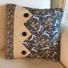 a decorative pillow with buttons on it