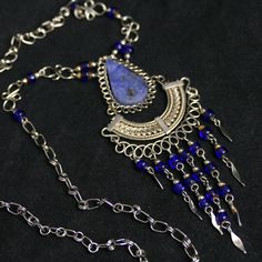 🌟 Elevate Your Style with our Blue Stone and Metalwork Necklace Collection 🌟 Discover the allure of true craftsmanship with our exquisite Blue Stone Necklace, Metalwork Wire Necklace, and Sodalite Stone Jewelry. Each piece is a masterpiece in its own right, created to enhance your elegance and make a statement of your individuality. 💙 Blue Stone Necklace: A Symphony of Elegance 💎 Our Blue Stone Necklace embodies the essence of serenity and style. The rich blue stone centerpiece is carefully Blue Kyanite Gemstone Bead Necklaces, Blue Kyanite Gemstone Beaded Necklace, Blue Bohemian Wire Wrapped Jewelry, Bohemian Blue Wire Wrapped Jewelry, Blue Kyanite Gemstone Necklace, Bohemian Blue Jewelry With Natural Stones, Handmade Sapphire Kyanite Necklace, Handmade Sapphire Necklace In Kyanite, Handmade Bohemian Sapphire Necklace