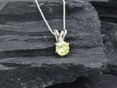 Green Peridot Pendant set with a Natural Peridot in a perfect diamond cut, flawless clarity & vivid green color at 7mm (1 Ct) from Brazil,. Solid 925 Sterling Silver ☞ made to last. Matching Ring & Earrings ☞ please ask meDetails:• Natural Peridot sourced from Brazil• Peridot: 7mm, 1 Ct, round cut• Dimensions: Height 13mm, Width 7mm• Free Complimentary Chain• Solid 925 Sterling Silver❀ Each Natural Gem is unique & will have Slight variations from the product pictures "no two Natural Stones are a Fine Jewelry Lime Green Birthstone, Lime Green Birthstone Jewelry For Anniversary, Anniversary Lime Green Birthstone Jewelry, Fine Jewelry Lime Green Gemstone, Formal Yellow Solitaire Jewelry, Green Pendant Necklace With Prong Setting, Classic Peridot Birthstone Jewelry, Green Pendant Necklaces With Prong Setting, Fine Jewelry With Lime Green Diamond