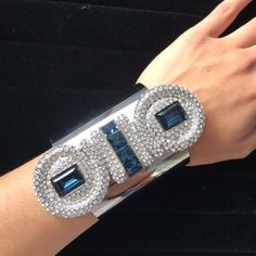 Atelier Swarovski By Karl Lagerfeld Collection Silver Tone And Blue Snake Crystal Cuff Bracelet. This Big Cuff Bracelet Instantly Classes Up Any Outfit. It'll Be Sure To Catch Eyes And Bring In The Compliments. Snake Like Design With Small White Crystals And Bigger Blue Pieces. Small Scratches On The Silver Cuff. Ships In A Swarovski Box And/Or In A Pouch. Blue Cuff Bracelet Bangle For Formal Occasions, Designer Cuff Bracelet For Parties, Blue Bangle Cuff Bracelet For Formal Occasions, Formal Blue Bangle Cuff Bracelet, Luxury Evening Bracelets With Bling, Luxury Silver Cuff Bracelet With Diamond Accents, Luxury Rhinestone Bracelets For Party, Glamorous Silver Cuff Bracelet With Rhinestones, Luxury Rhinestone Party Bracelets