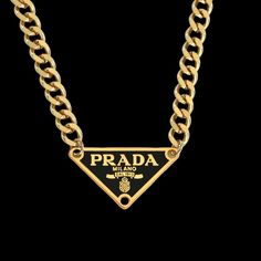 Vintage Prada pendant on a gold curb chain necklace. Repurposed from authentic Prada bag. Gold Chain Brass Pendant Necklace, Gold Chain Pendant Necklace In Brass, Luxury Gold Chain Medallion Necklace, Classic Gold Medallion Chain Necklace, Luxury Gold Chain Necklace With Medallion, Gold Plated Gold Charm Necklace With Curb Chain, Vintage Figaro Chain Pendant Jewelry, Gold-tone Pendant Chain Necklace With Figaro Chain, Luxury Pendant Charm Necklaces With Chain