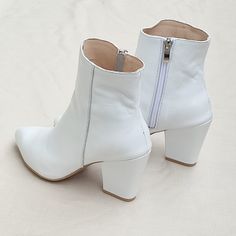 "Lira - handmade high heel boots made of high-quality white genuine leather. The exceptionally soft upper and comfortable leather insole guarantee the highest comfort. The shoes have a fitted upper and a carefully profiled toe, the slim shape visually lengthens the figure. High heel 8 cm = 3\" Sizes UK, EU, US/ feet dimensions / centimeters and inches 3 UK / 36 EU / 5 US insoles length 24 cm = 9.5 inches 4 UK / 37 EU/ 6 US insoles length 25 cm = 9.8 inches 5 UK / 38 EU / 7 U insoles length 25.5 White High Ankle Boots With Sculpted Heel, White Ankle Heeled Boots With Sculpted Heel, White Heeled Boots With Sculpted Heel And Pointed Toe, White Ankle Boots With Sculpted Heel, White Pointed Toe Heeled Boots With Sculpted Heel, White Pointed Toe Boots With Sculpted Heel, White High Heeled Boots With Sculpted Heel, White High Heel Boots For Spring, White High Heel Boots With Sculpted Heel