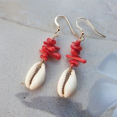 Beautiful cowrie shell earrings with red coral chips are beachy coral earrings, ocean earrings or red coral earrings- made of 6-15mm bamboo chip beads and a cowrie shell bead. These coral beads are made of bamboo. Bamboo is a whitish marine plant, dyed to imitate coral. Coral is the absolute summer stone and color and it is a perfect sea inspired jewelry, coral jewelry,shell jewelry, cowrie jewelry, beach jewelry or summer jewelry. Perfect gift for her or beachlover gift NB! The listing is for o Red Bohemian Jewelry For Vacation, Bohemian Red Jewelry For Vacation, Shell Earrings For Beach Season Gift, Beach Season Shell Earrings Gift, Beach Season Gift Shell Earrings, Coral Jewelry For Summer Beach Occasions, Summer Beach Coral Jewelry, Dangle Cowrie Shell Earrings For Beach, Coral Earrings For Summer Beach Occasion