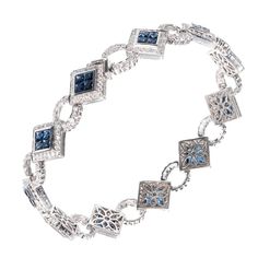 Elegant Blue Topaz Bracelet, Blue Sapphire Jewelry With Single-cut Diamonds, Blue Sapphire Jewelry With Single Cut Diamonds, Elegant White Gold Bracelet With Blue Topaz, Luxury Sterling Silver Tennis Bracelet With Diamond Accents, Fine Jewelry With Sapphire And Single Cut Diamonds, Luxury Hand-set Sapphire Jewelry, Silver Sapphire Jewelry With Pave Setting, Luxury Blue Bracelets With Hand Set Details