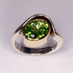 A very bright and pretty ring for you will dote on.  Gorgeous even green peridot sparkles in this sterling silver sea wave setting.   This piece can be made in a variety of metals including hand forged white, yellow, and rose gold as well as sterling silver. If you would like a quote for any of these materials please contact me. To see this ring style set with a pink tourmaline: https://www.etsy.com/ca/listing/169483988/pink-tourmaline-organic-sterling-silver This piece is ready to ship in size 7 1/2, or can be custom made to your size in 4-6 weeks.  Metals All gold, platinum, and silver used in my work is custom formulated and forged in my Waterton Studio.  Metals are first cast in a custom made ingot, then hammered and drawn before they are ready for working.  Producing my own gold allow Silver Sea, Sea Wave, Green Peridot, Precious Gems, Ring Size 7, Pink Tourmaline, Fashion Set, Sterling Silver Ring, Custom Jewelry