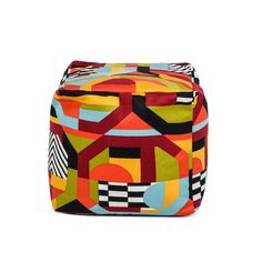 a multicolored bag with geometric shapes on it, sitting against a white background