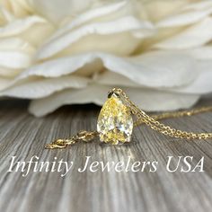 "This pendant is a pear shape yellow simulated diamond made with pure 14k yellow gold and 18\" yellow gold cable chain included item #5697 Approximate total carat weight: 2.00ctw diamond equivalent -Center Stone Size: 10x7mm -Gem Type: Simulated Diamond -Center Stone Shape: Pear Shape -Center Stone Color: Yellow -Center Stone Clarity: VVS1 -Metal Type and Purity: 14k Yellow Gold -Chain: 18\" delicate 14k gold chain / heavier option with lobster claw available (use dropdown to select) -Country of Classic Pear-shaped Drop Necklace For Anniversary, Gold Solitaire Necklace With Brilliant Cut Teardrop Pendant, Gold Teardrop Pendant Solitaire Necklace With Brilliant Cut, Gold Brilliant Cut Teardrop Pendant Necklace, Yellow Gold Pear-shaped Jewelry For Anniversary, Gold Teardrop Pendant Solitaire Necklace For Anniversary, Teardrop Anniversary Drop Necklace In Fine Jewelry Style, Teardrop Fine Jewelry Drop Necklace For Anniversary, Pear-shaped Yellow Gold Jewelry For Anniversary