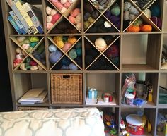 the shelves are full of yarn and crochet supplies for knitting, including balls of yarn