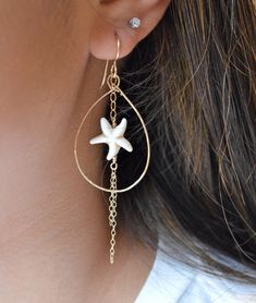 "These adorable starfish bead earrings are made from natural colored magnesite stone. They have delicate strands of gold chains dangling from them within a gold filled hammered teardrop. Teardrop measures approximately 1.5\" in length." Beach Jewelry With Dangling Charms, Beach Jewelry With Teardrop Dangling Beads, Teardrop Dangling Beads Jewelry For Beach, Beach Teardrop Jewelry With Dangling Beads, Ocean-inspired Starfish Dangle Jewelry, Star Charm Drop Earrings For Beach, Gold Dangle Teardrop Earrings For Beach, Starfish Charm Dangle Jewelry, Beach Dangle Jewelry With Star Charm