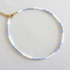 Blue bead choker white beaded choker gold bead choker colorful bead choker seed bead choker boho bead choker summer necklace trendy choker Measure the length of your neck with a measuring tape or you can use any thread, rope, or cable for telephone and after apply the measurements to a regular ruler. These are multi-colored, opaque shiny beads of size 10/0. Choker is 13 inches with a 2 inches adjustable extender chain. 15 inches full length. Summer Choker Necklace, Summer Seed Bead Bracelet Ideas, Seed Beads Necklace Ideas, Cute Seed Bead Necklaces, Summer Necklace Diy, Seed Bead Necklace Ideas, Summer Beaded Necklace, Summer Necklaces, White Beaded Necklace