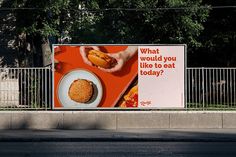 a billboard advertising what would you like to eat today?