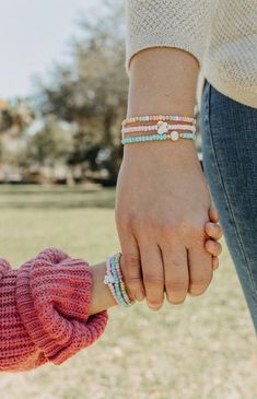 Lighten up your spring look with our Pastel Spring Bracelet Set! This 3-bracelet set comes in both adult and mini sizes, featuring delicate pastel colors, whimsical pearl bead detailing, and 18k gold beads. Perfect for Easter or a fresh addition to your jewelry collection! Dainty Spring Beaded Bracelets, Everyday Beaded Bracelets For Spring, Beaded Bracelets For Everyday Spring Wear, Casual Spring Jewelry With Tiny Beads, Playful Spring Bracelets With Round Beads, Playful Beaded Bracelets For Spring, Spring Friendship Bracelets For Everyday Wear, Playful Spring Bracelets With Colorful Beads, Playful Bracelets With Colorful Beads For Spring