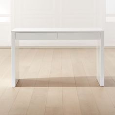 a white table sitting on top of a hard wood floor