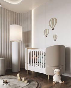 a baby's room with a crib, lamp and stuffed animal on the floor