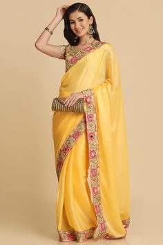 Product Features: Saree Color: Light Yellow Blouse Color: Cream Saree Fabric: Chiffon Blouse Fabric: Dupion Silk Saree Work: Woven Saree Border And Pallu: Lace Border And Fancy Pallu Length Of Saree: 5.5 Metres Occasion: Party Package Contain: 1 Saree And 1 Blouse Disclaimer: There Will Be Slight Difference In Digital To Actual Image Transitional Organza Saree With Dori Work, Yellow Chinon Pre-draped Saree, Yellow Blouse Piece With Sheer Dupatta, Yellow Pre-draped Saree With Resham Embroidery For Transitional Seasons, Traditional Chiffon Pre-draped Saree For Eid, Navratri Chiffon Saree With Pallu Detail, Navratri Chiffon Saree With Pallu, Transitional Pre-draped Saree With Dori Work, Traditional Chiffon Pre-draped Saree For Diwali