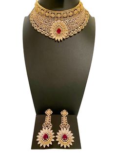 Featuring a stunning petal design, this choker necklace showcases great craftsmanship. This elegant necklace is perfect for a wedding day or any special occasion, complementing a saree beautifully. Elevate your look with this expertly crafted piece. This jewellery set includes a necklace and matching earrings. Jewellery Care- Keep the jewellery dry, avoid contact with perfumes and water. Large Choker Necklace, Diamond Choker Necklace, Bridal Choker, Diamond Choker, Elegant Necklace, A Necklace, Jewellery Set, American Diamond, Elegant Necklaces