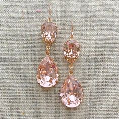 "Heatherly Designs signature double layer teardrop long dangling earrings made with genuine Swarovski® crystals in blush pink and are set in plated brass.  →Make it a set with the matching necklace: http://etsy.me/1Tsvegd ●Nickel free ●Size (L x W): 2\" x 1/2\" or 50 x 13mm ●Swarovski crystal color(s): Vintage Rose ●Arrives in our signature Heatherly gift box. Handmade with ❤ by Heather ● ● ● ● ● ● ● ● ● ● ● ● ● ● ● ● ● ● ● ● ● ● ● ● ● ● ● ●   →Quantity Discounts listed below: 10% off 3-9 pcs - Gold Pink Earrings, Pink Dangly Earrings, Pink Bridal Accessories, Pink Drop Earrings, Rose Gold Bridal Earrings, Champagne Earrings, Morganite Earrings, Fav Products, Bridal Earrings Chandelier