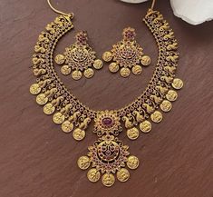 South Indian Bridal Traditional with matte gold plating Necklace Set with Earrings. Temple choker set. Gorgeous 24 K gold plated. This Necklace set comes in a beautiful gift box, making it an ideal gift for birthdays, weddings or anniversaries. Occasion: Perfect choice for any Indian occasion. Care: It is advisable that you keep products away from direct heat, humidity, and moisture. It is best to preserve your jewelry in the bag/box provided with the package. 100% Satisfaction Guarantee, Highes Gold Necklace Indian, Gold Coin Necklace, Indian Necklace, Gold Long Necklace, Jhumka Earrings, Gold Choker, Gold Coins, Coin Necklace, Earrings Photo