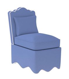 a blue chair with scalloped back and foot rest