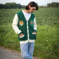 Show your Hawkins High School Pride by getting into uniform with our cozy knit cardigan featuring embroidered chenille patches. Go Tigers! 100% Acrylic Oversized Unisex Fit Embroidered Chenille Patches Stranger Things x Cakeworthy Licensed Product. Model Sizes: Male Model: Medium Female Model: Small Casual Embroidered Knit Outerwear, Winter College Cardigan, Long Sleeve Winter Sweater For Campus, Casual Winter Cardigan For College, Collegiate Long Sleeve Cotton Cardigan, Collegiate Cotton Long Sleeve Cardigan, Winter Varsity Cardigan, Varsity Cardigan For Winter College Season, Collegiate Long Sleeve Cardigan For College