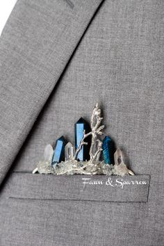 Striking Groom's Pocket Boutonniere features genuine crystal gems! A breathtaking addition to weddings and events. This style slides effortlessly into the suit pocket. No pinning or additional materials required! Won't poke or put a hole into suit fabric. Crystals: Labradorite Crystal (Blue, Gray and Green Hues) , Quartz This item is made to order. Each crystal has distinct natural qualities. Metal: Karat Gold; Silver Dimensions: Fits pocket sized 4.5 inch depth x 3 inch width or larger Crystal Pocket Square, Silver Wedding Crystals, Elegant Silver Crystals For Wedding, Elegant Silver Wedding Crystals, Crystal Boutonniere, Crystals Labradorite, Pocket Boutonniere, Lapel Wedding, Gothic Wedding Theme