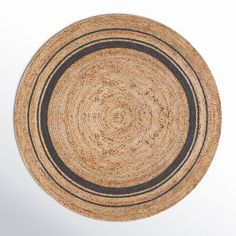 a round rug with black stripes on it