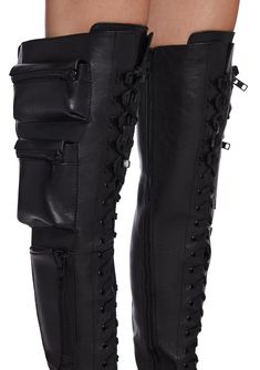 These thigh high combat boots have a vegan leather construction, heeled platform soles, zippered pockets on the sides, buckle strap details, adjustable lace-ups, and side zip closures. Knee High Combat Boots Outfit, High Combat Boots Outfit, Long Combat Boots, Boots With Pockets, Thigh High Combat Boots, How To Wear Thigh High Boots, Thigh High Leather Boots, High Combat Boots, Steel Boots