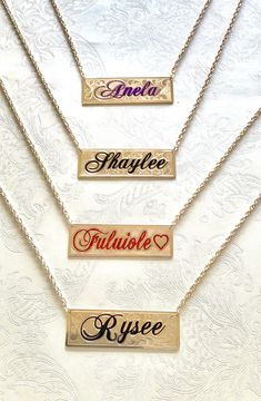 "Nameplate necklace with your name or couple names customized. The plate is made with 14/20 yellow gold filled on both sides. The thickness is 1.02mm. The plate measures 1\"wide by 3\" long. The maximum number of letters is 9. The letters are engraved an enameled in old English or script. The chain is attached to the plate with circle bails. The chain is a gold filled 4.00mm double rope with a lobster claw. The background design is hand engraved with Victorian scrolls or sand finish. The process Elegant Personalized Rectangular Name Necklace, Custom Nameplate Necklace In Rose Gold, Birthstone Nameplate Necklace, Custom Rose Gold Nameplate Necklace With Name, Diamond Nameplate Necklace, Gold Customizable Nameplate Necklace, Elegant Rectangular Name Necklace, Elegant Customizable Rectangular Name Necklace, Anniversary Engraved Nameplate Necklace