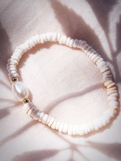 Choose one or all. These stretchy natural white puka shell bracelets evoke visions of Hawaii's white sands and soothing shores. Super rare tiny puka shells make these bracelets one of a kind.Stack these gold seashell bracelets high and you'll be ready for your tropical escape.✦ CHOICES DETAILED BELOW ✦✧ Style A: Natural White Baroque Freshwater Pearl✧ Style B: Natural Mauve Pink Freshwater Pearl✧ Style C: Natural 8-10mm Baroque Tahitian Pearl✧ Style D: Gold Filled Beads ✧ Style E: Gold Plated Sh Puka Shell Bracelet, Seashell Bracelet, Hawaii Jewelry, Beads Style, Surfer Bracelets, Tropical Escape, Puka Shell, Shell Bracelet, Mauve Pink