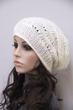 "100% Wool hand knitted hat. This ivory hat features on an interesting shape with irregular patterns and rolled edges. It suits ant outfits style. Color:Ivory Length:11 1/2\" from top to bottom Measurements: 18\" (relaxed) 26\" (stretched) - it can fit any size! Hand wash in cold water with detergent or shampoo and lay flat until dry." Warm White Bonnet For Fall, White Warm Casual Bonnet, Casual Warm White Bonnet, Cozy Soft Knit White Bonnet, Trendy Warm White Beanie, Casual White Knitted Bonnet, Casual Cream Soft Knit Bonnet, Casual White Bonnet One Size, Casual White One-size Bonnet