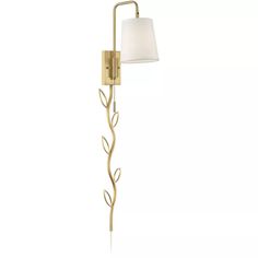 a wall light with a white shade on the side and a gold leaf design lamp