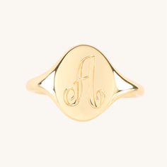 A perfectly proportioned, classic signet ring, scaled especially well for a pinkie finger. A true wear-for-forever piece.Looking for this ring in a size larger than 6? We suggest the Large Heirloom Signet Ring, which has a slightly thicker band better suited for this size range. Classic Oval Signet Ring With Polished Finish, Timeless Oval Signet Ring With Polished Finish, Luxury Oval 14k Stamped Signet Ring, Classic 14k Gold Stackable Rings With Initials, Classic Formal Initial Ring Stamped 14k, Classic Oval Signet Ring Stamped 14k, Timeless Oval Dome Ring Stamped 14k, Timeless Oval Signet Ring, Tarnish Resistant, Classic Oval Signet Ring Tarnish Resistant