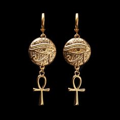 "Treat yourself or a loved one to these beautifully made earrings. The earrings are 1 3/8\" long (4.4cm). They are made of 24K gold plated brass and are expensive-looking. Choose the earrings quantity (single - 1 earring or a pair - 2 earrings) from the drop-down menu when you add items to the cart. For more of the Egypt theme jewelry: https://www.etsy.com/ca/shop/LeafOnWaterStudio?search_query=Egypt  You will receive your earrings carefully packed and ready to gift. I will include a message by request  ★ See all of our items at https://www.etsy.com/ca/shop/LeafOnWaterStudio ★ The sold jewelry is not made of solid gold and is only gold plated. To extend the life of your jewelry please keep it away from water and chemicals ★" Egyptian Style Jewelry, Nickel-free Ankh Gold Earrings, Engraved Metal Drop Earrings, Symbolic Metal Jewelry With Matching Earrings, Ankh-shaped Metal Earrings For Gift, Symbolic Pierced Dangle Jewelry, Ankh Shaped Metal Earrings For Gift, Symbolic Nickel-free Drop Plug Earrings, Nickel-free Symbolic Drop Plug Earrings