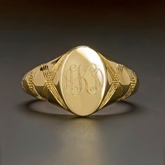 Featured here is an absolutely immaculate vintage inspired signet ring that is hand engraved with a contemporary take on Florentine engraving!Originating from the Latin word “signum” meaning “sign”, signet rings originated amongst the ruling classes and were historically marked with a unique family crest. These rings were used to mark and seal documents by pressing the face into hot wax. Signet rings were not only used as official signatures, but were so personal and specific to the individual t Luxury Oval 14k Stamped Signet Ring, Timeless Gold Signet Ring With Hallmarks, Classic Gold Oval Signet Ring, Antique Oval Signet Ring With Polished Finish, Heirloom 14k Gold Signet Ring For Formal Occasions, Engraved Yellow Gold Signet Ring For Formal Occasions, Formal Engraved Yellow Gold Signet Ring, Gold 14k Stamped Signet Ring For Formal Occasions, Formal Gold Signet Ring Stamped 14k