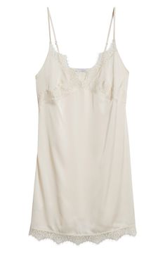 Feel your most glamorous through your morning and nighttime routines in this satin chemise trimmed in delicate lace. 25" center front (size medium) V-neck Adjustable straps 100% polyester Machine wash, dry flat Imported Sheer V-neck Slip Dress, Satin V-neck Slip Dress With Contrast Lace, V-neck Satin Camisole With Lace Trim, Chic Slip Dress With Contrast Lace, Lace Slip Dress With Delicate Straps For Daywear, Elegant V-neck Slip Dress With Contrast Lace, Spring Silk Slip Dress With Delicate Lace, V-neck Satin Chemise For Wedding Night, Lace Slip Dress For Sleep