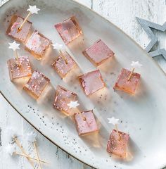 some food is on a white plate with silver stars