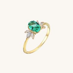 The Emerald Flower Ring will demonstrate your taste with its elegancy so that you can feel yourself more stylish and special at any time of the day with the Emerald Flower Ring, which will gather all the attentions around you with its sparkly marquise stones and glamorous stance of the unique centre stone. - Made in 14k solid gold - Decorated with handset lab grown emerald stone on 14k solid gold - Band Width: 1.43 mm / 0.056 inches- Stone Size: 5.93x7.10 mm / 0.233x0.279 inches- Thickness: 1.54 Luxury Emerald Ring With Gemstone Accents For Wedding, Elegant Marquise Topaz Ring For Wedding, Elegant Marquise Topaz Wedding Ring, Luxury Crystal Ring With Gemstone Accents For Wedding, Elegant Diamond Cluster Ring With Gemstone Accents, Marquise Cluster Ring With Accent Stones For Wedding, Elegant Open Diamond Ring With Gemstone Accents, Elegant Cluster Ring With Gemstone Accents, Elegant Cluster Rings With Gemstone Accents