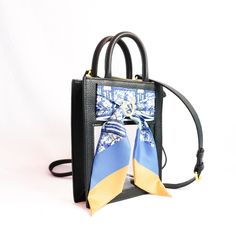 Gameday has never looked better. Our new Mini Calista Clear stadium bag is the perfect combination of high street chic and clear bag compliance. The custom-designed Twilly scarf creates a natural buffer between prying eyes and all inside. Zip through security in no time, and turn all the right heads on the way. Details: Size: 6" x 7.5" x 2" Made of Genuine Cowhide with Luxury Vinyl Windows Zipper Closure Adjustable and Removable Crossbody Strap Removable Silk Twilly Scarf with Gold-Plated Horses Clear Stadium Bag, Vinyl Windows, Stadium Bag, Blue Chinoiserie, Twilly Scarf, Clear Bag, Twilly, Clear Bags, Window Vinyl