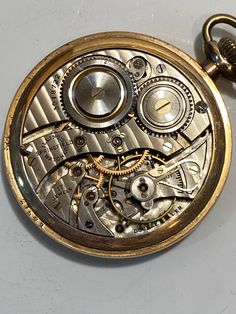 "Vintage Hartdegen & Co Pocket Watch, 3518722, 15 jewels, 1-3/4\" in diameter Illinois Springfield Watch Co, Double Roller. Buyer pays 10 dollars priority insured shipping and handling in US only. Message me with questions. Thanks for looking." Antique Chronometer Watch, Antique Chronometer Watch Accessories, Vintage Analog Round Watches, Antique Round Pocket Watch With Subdials, Collectible Yellow Gold Watch, Antique Round Pocket Watch For Anniversary, Vintage Watch Accessories With Subdials, Analog Pocket Watch With Round Dial For Formal Occasions, Formal Round Analog Diamond Watch