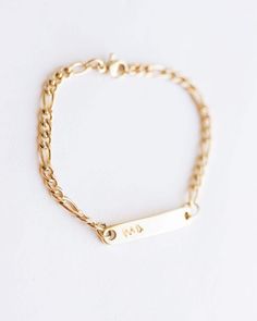 Personalized Children's bracelet in 14k gold over stainless steel. A lovely christening gift. Also cute as a baby gift. The bar measures 3 cm / 1.18 inches and the bracelet can be made at any size to 16 cm / 6.3 inches. It is nickel, lead free and it is hypoallergenic. It is not going to tarnish or change color. * ADD a gemstone on your bracelet: http://etsy.me/2naJrV4 * ADD an evil eye on your bracelet: http://etsy.me/2ocLyYT * ADD a cross or a clover or an infinity charm on your bracelet as yo Personalized Kids Gifts, Kids Name Bracelet, Kids Bracelet, Infinity Charm, Kids Bracelets, Personalized Gifts For Kids, Jewelry Card, Vermeil Jewelry, Name Bracelet