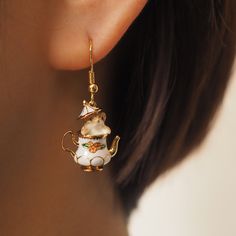 Earrings and necklaces with cute squirrels peeking out from a ceramic tea pot decorated with flower patterns. A fantastical world that looks like something out of a fairy tale. The lid of the tea bottle rests on the squirrel's head, resembling her hat. I wonder if the inside of the tea jar is the squirrel's secret home. 
 
 
 Item 
 
 Earrings 
 Earrings 
 Necklace 
 
 
 Size 
 
 Length: 3.7cm 
 Width: 0.5cm 
 
 
 Material 
 
 Silver529 
 Alloy 
 
 
 Others 
 
 Please refrain from ordering if yo Teapot Earrings, Teapot Necklace, Paper Rings, Earring Gift, Funky Jewelry, Drop Earring, Enamel Jewelry, Dream Jewelry, Pretty Jewellery